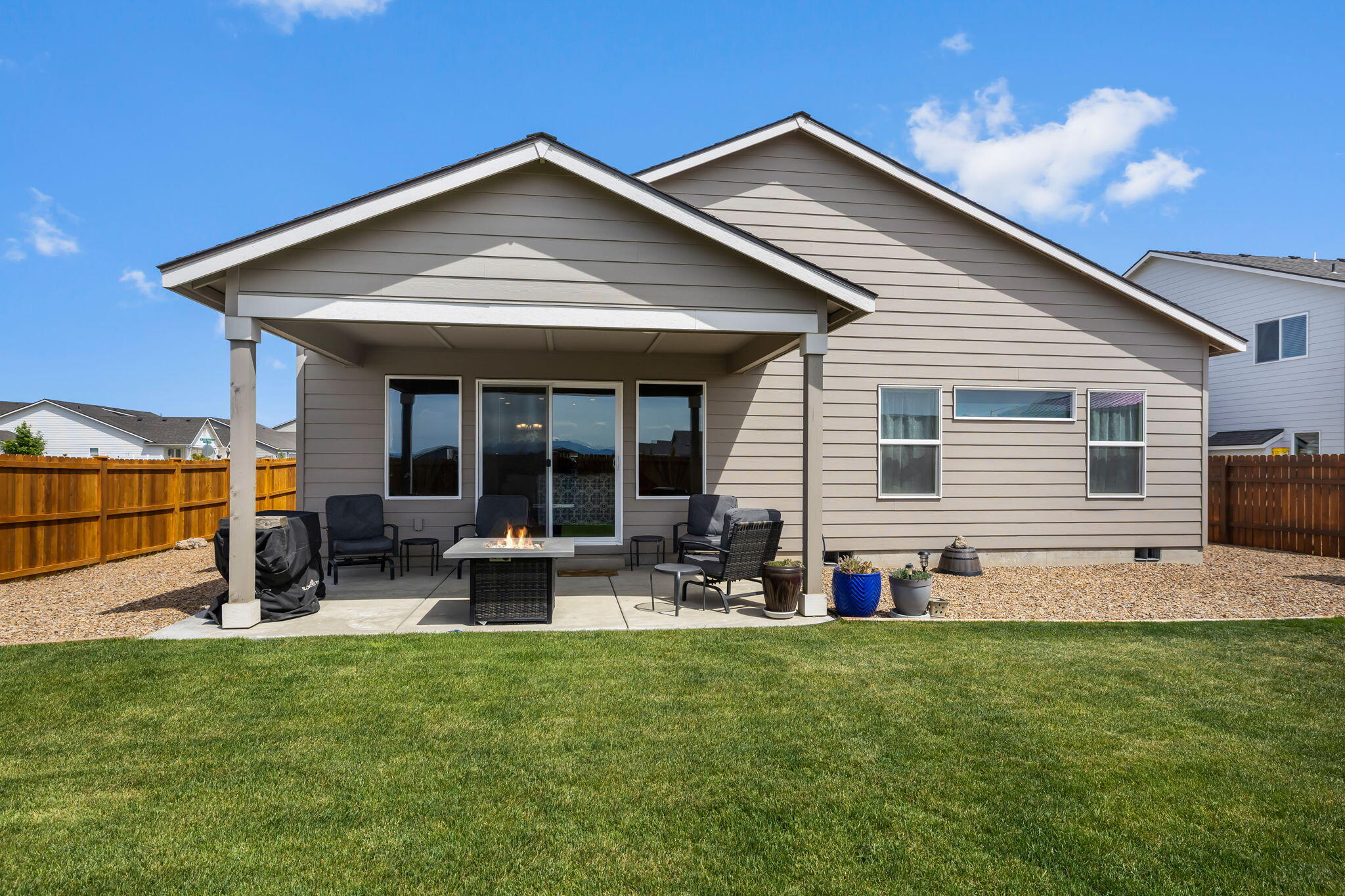 1132 Northwest Golf Course Drive Madras, OR 97741 - Photo 24 of 36 a front view of house with yard and outdoor seating