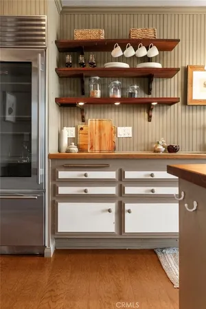 a kitchen with stainless steel appliances granite countertop a stove and a refrigerator