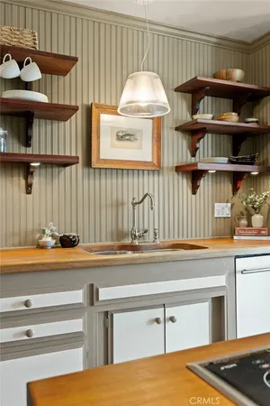 a bathroom with a sink a mirror and a shower