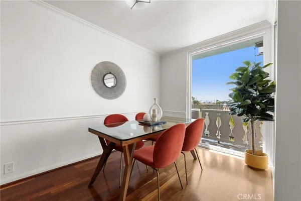 a balcony with table and chairs