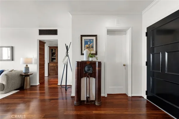 a balcony with furniture and wooden floor