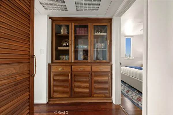 a bed room with a bed and a chair