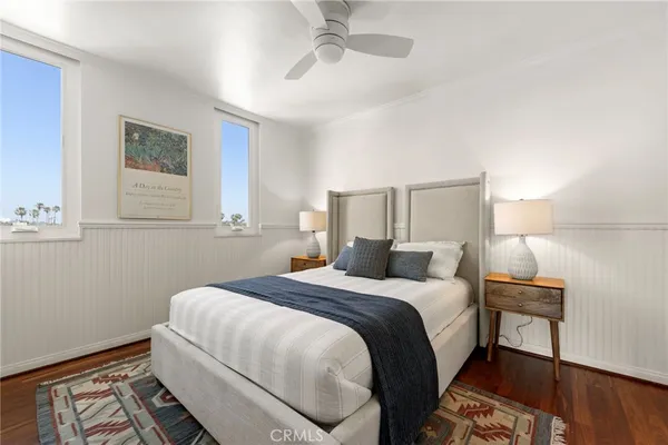 a bedroom with bed and window