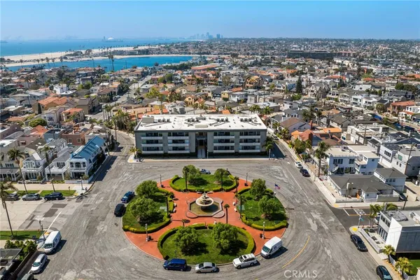 an aerial view of a city with ocean view