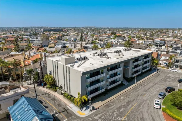 an aerial view of a house with a ocean view