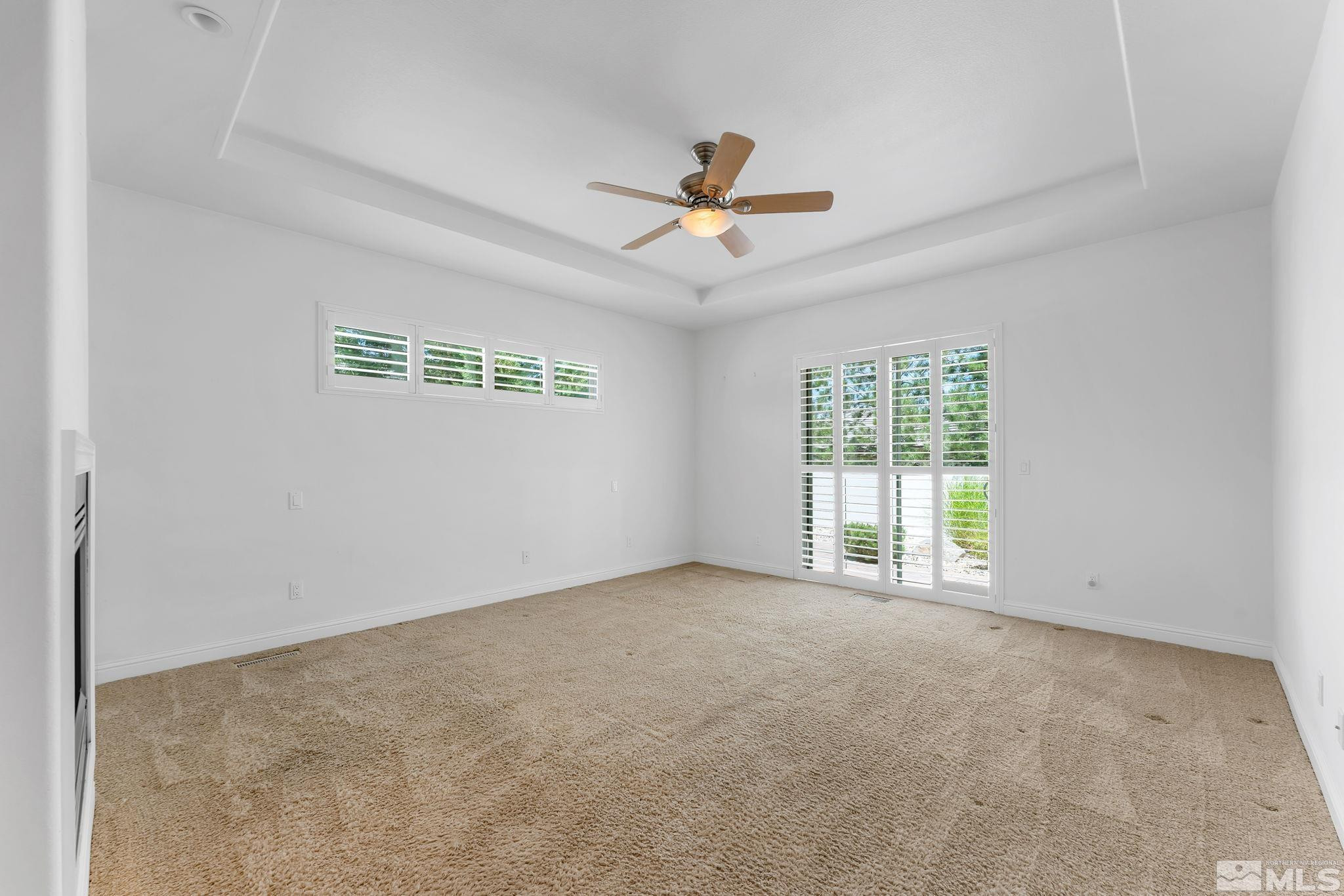 2681 Spearpoint Drive Reno, NV 89509 - Photo 17 of 36 an empty room with windows and fan
