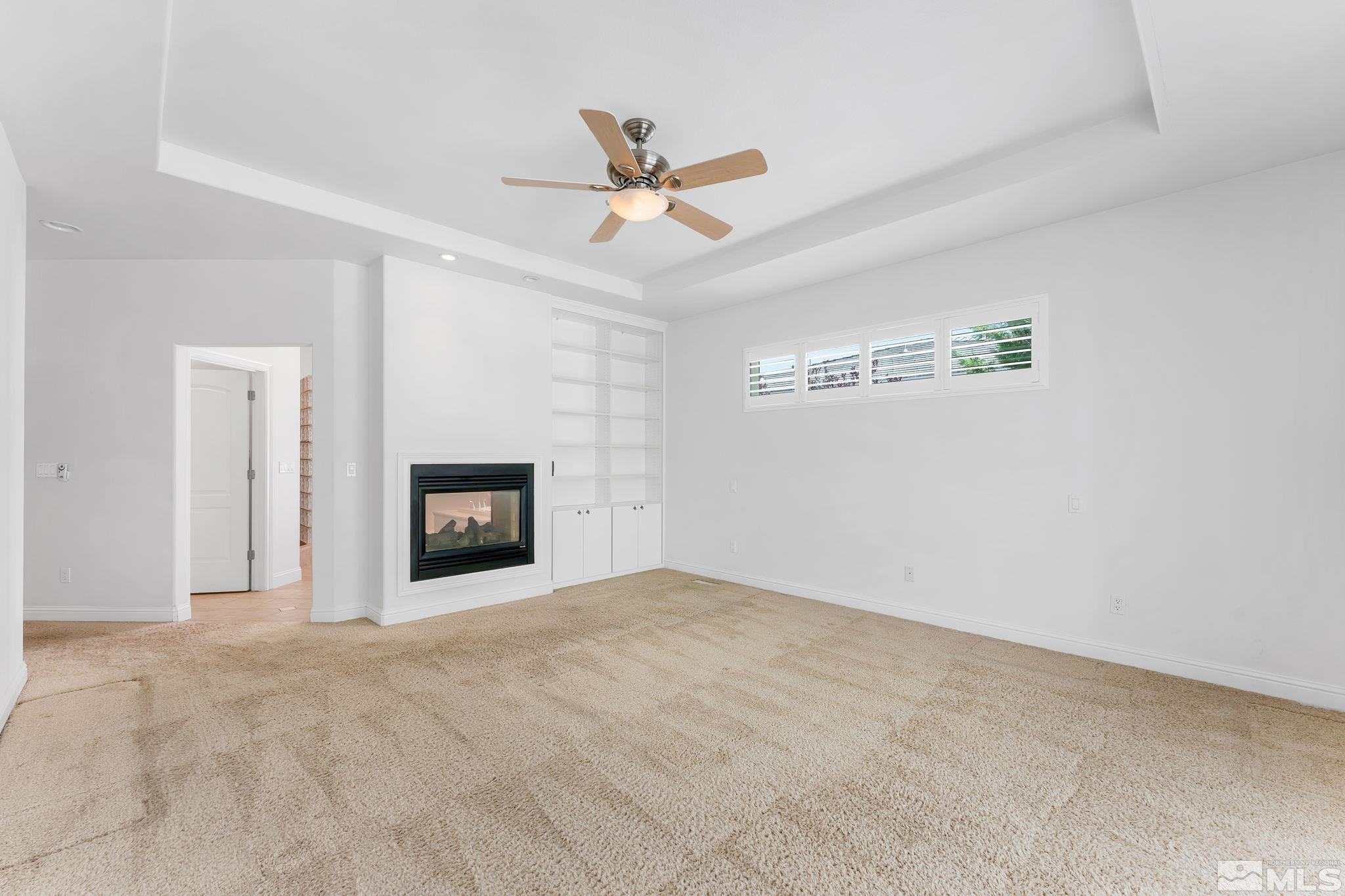 2681 Spearpoint Drive Reno, NV 89509 - Photo 18 of 36 an empty room with windows and ceiling fan