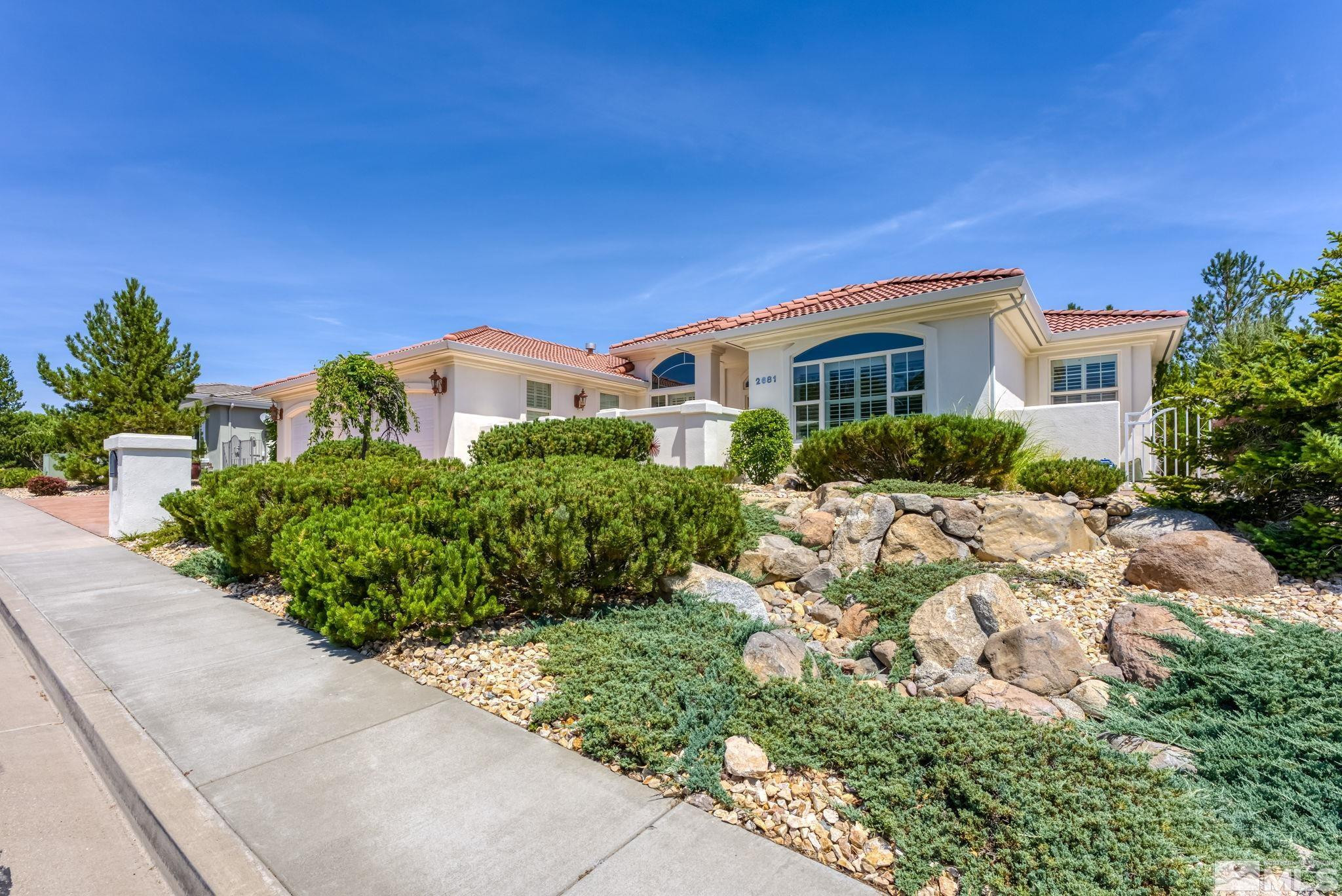 2681 Spearpoint Drive Reno, NV 89509 - Photo 2 of 36 a front view of a house with a yard