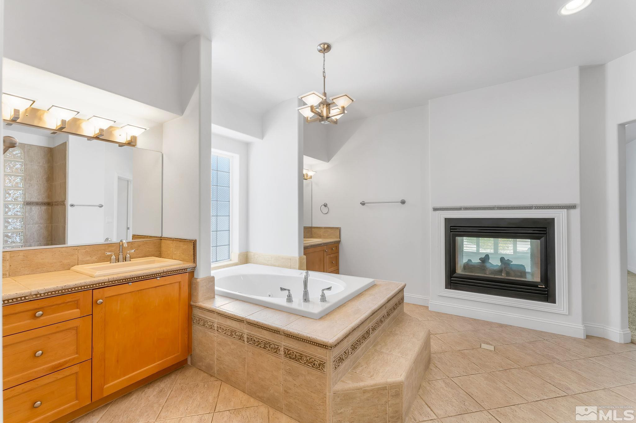 2681 Spearpoint Drive Reno, NV 89509 - Photo 21 of 36 a view of a bathroom sink and a mirror