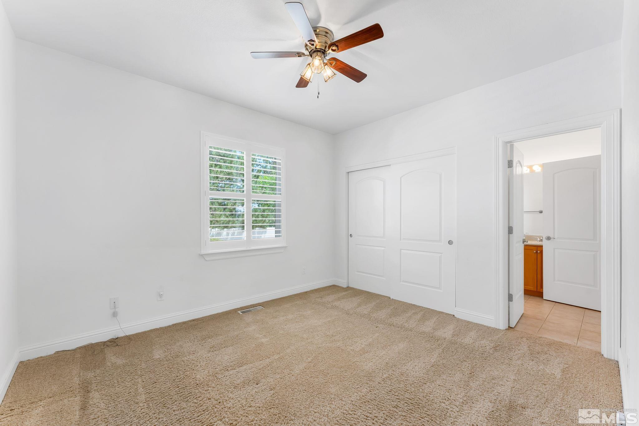 2681 Spearpoint Drive Reno, NV 89509 - Photo 22 of 36 a view of an empty room with a window