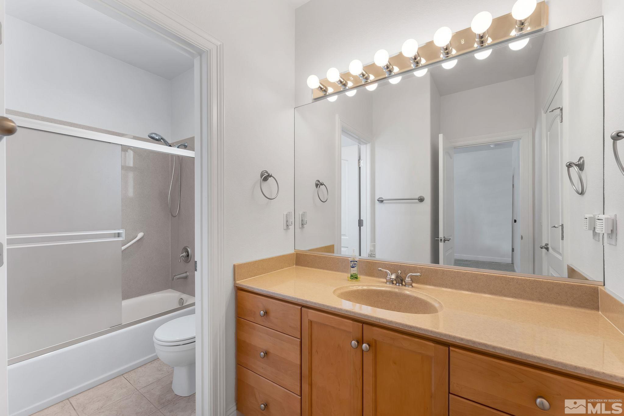 2681 Spearpoint Drive Reno, NV 89509 - Photo 24 of 36 a bathroom with a sink a toilet and shower