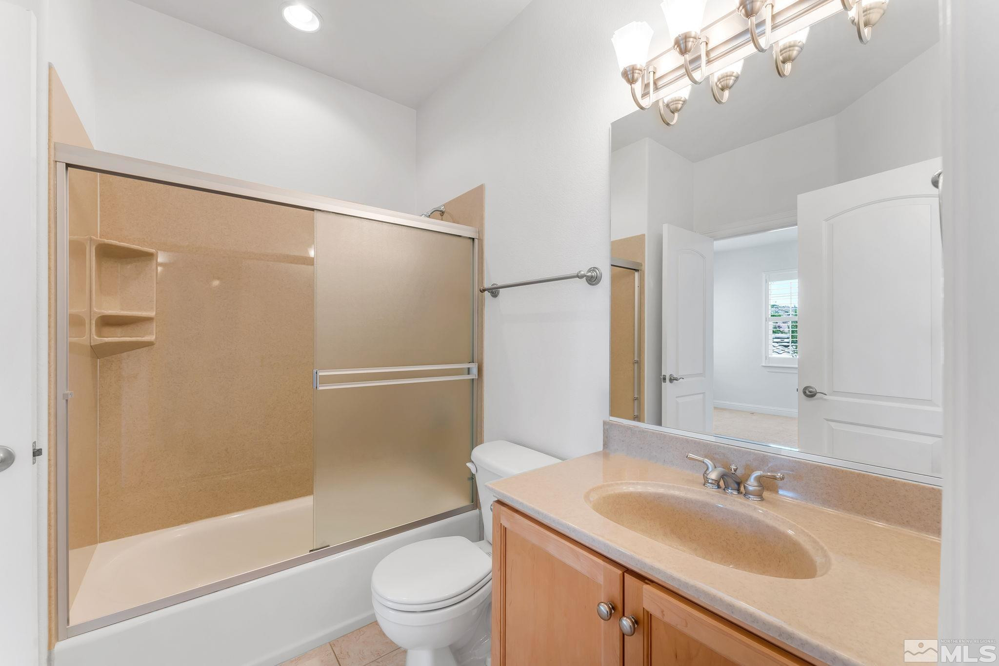 2681 Spearpoint Drive Reno, NV 89509 - Photo 27 of 36 a bathroom with a sink a toilet and shower