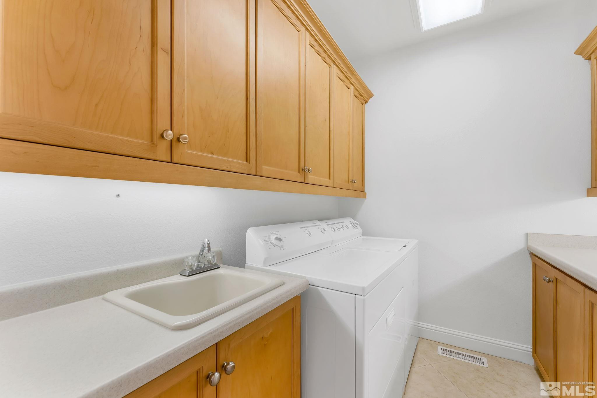 2681 Spearpoint Drive Reno, NV 89509 - Photo 29 of 36 a utility room with dryer and washer