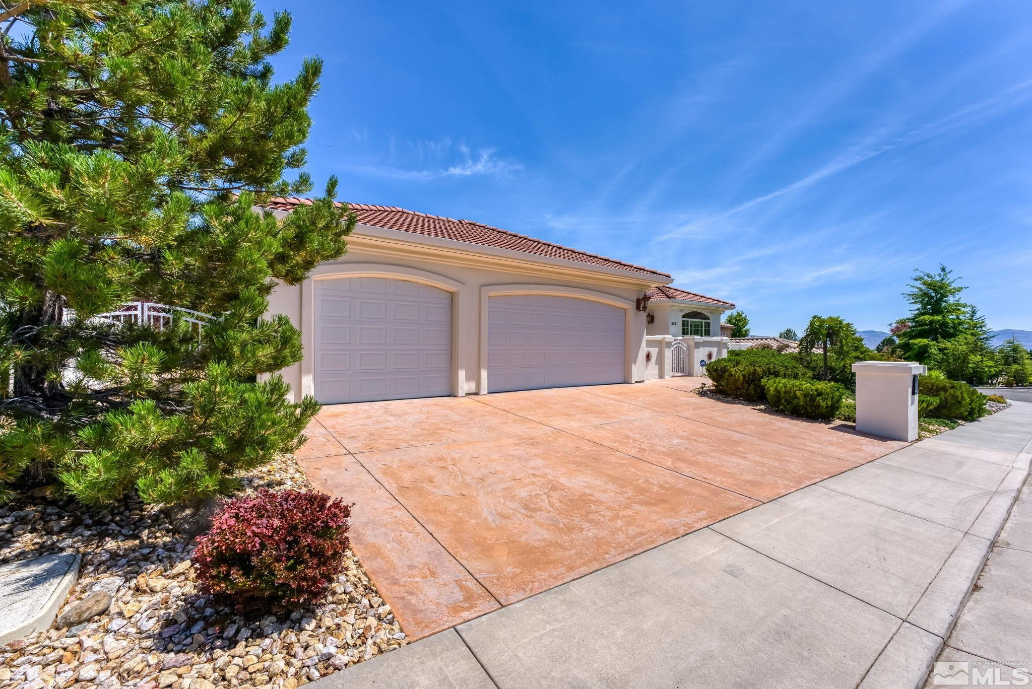 2681 Spearpoint Drive Reno, NV 89509 - Photo 3 of 36 a front view of a house with a yard