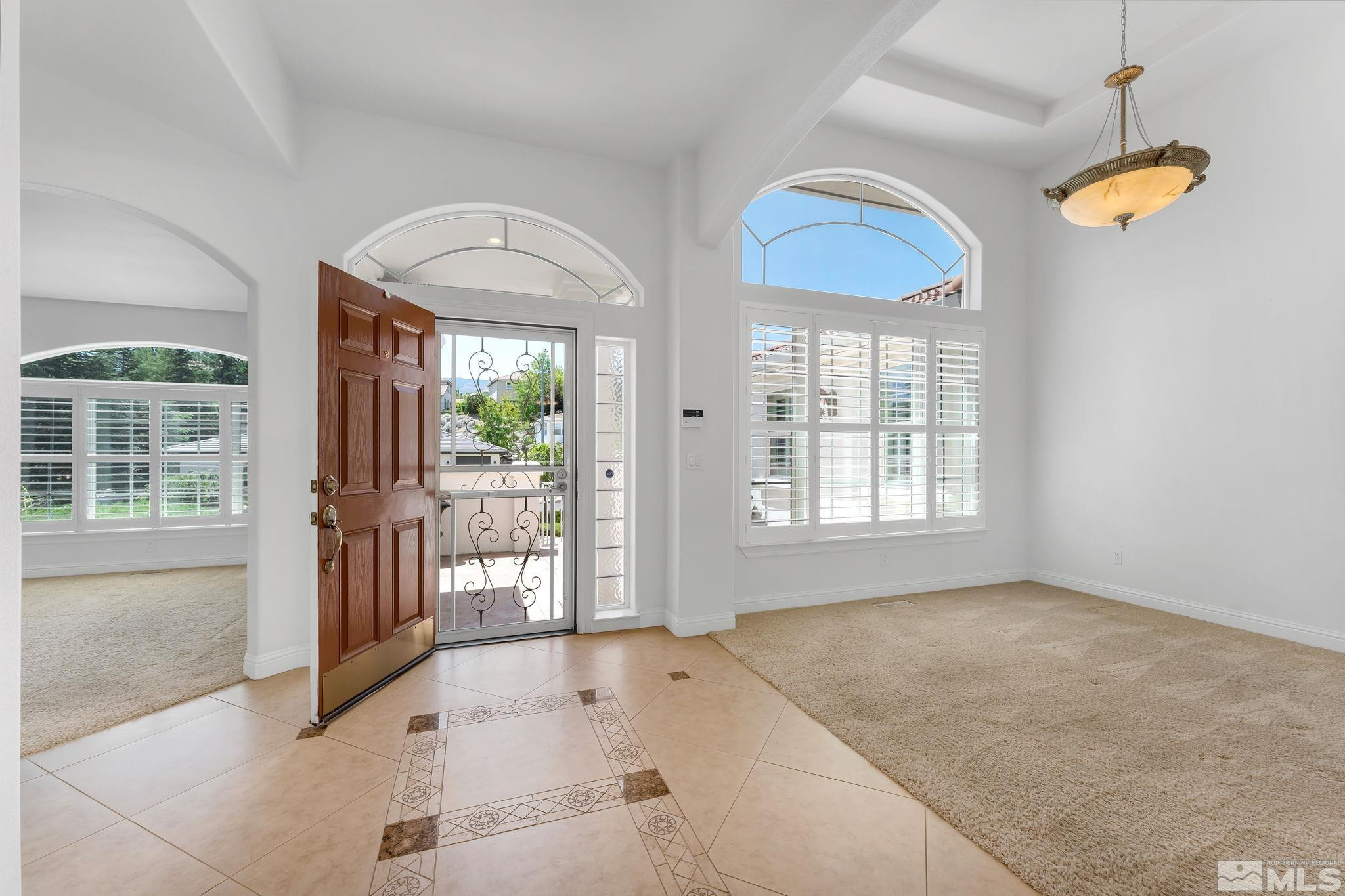 2681 Spearpoint Drive Reno, NV 89509 - Photo 5 of 36 a view of an empty room with a window