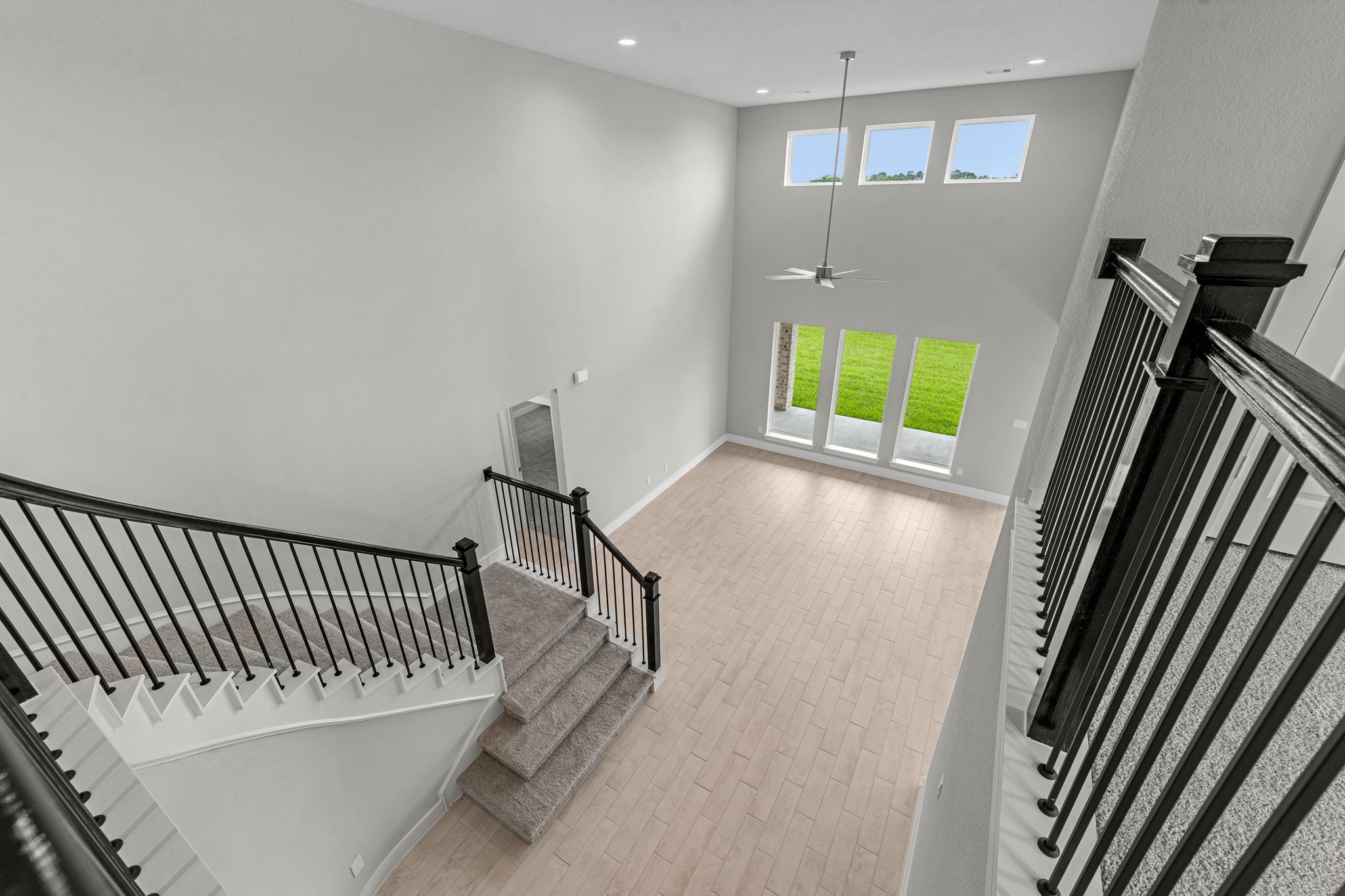 3410 Everglade Lane Rosenberg, TX 77471 - Photo 20 of 39 a view of a hallway with wooden floor and stairs
