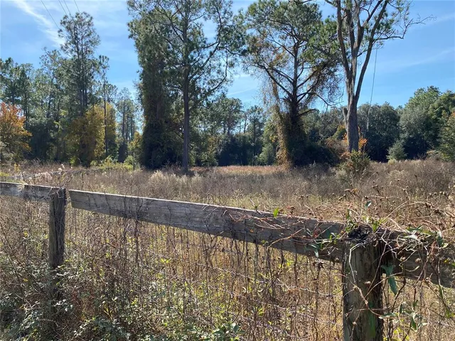 a view of a backyard of the house