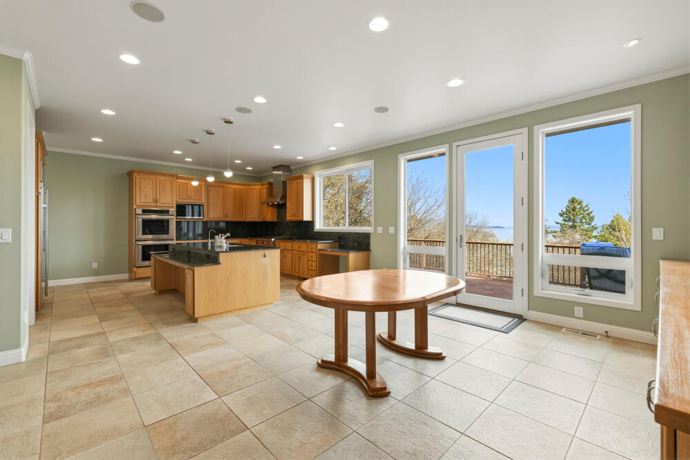6586 Cooper's Hawk Road Klamath Falls, OR 97601 - Photo 20 of 68 a kitchen with stainless steel appliances kitchen island granite countertop a sink and cabinets