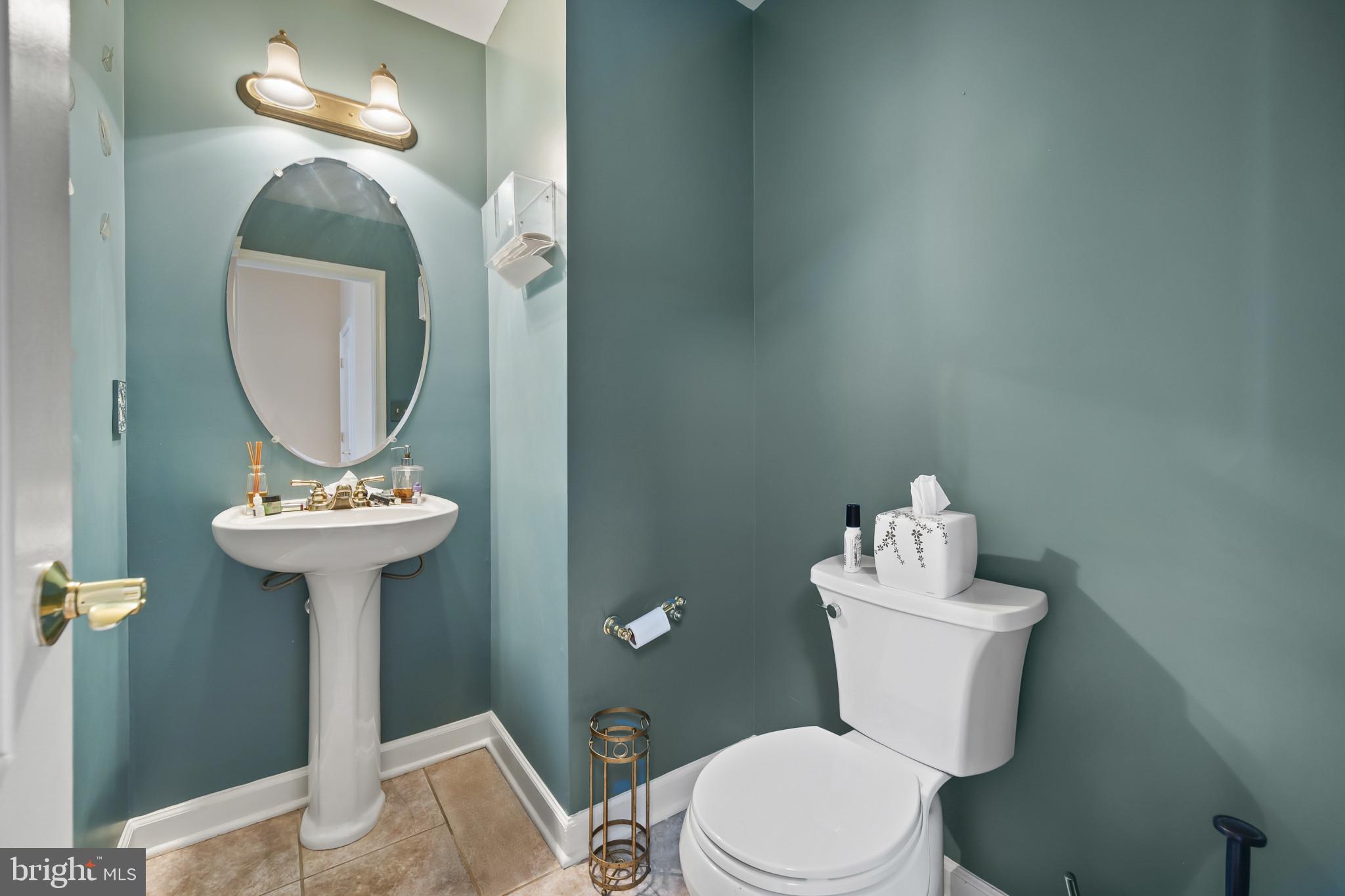 3261 Nile Lane Laurel, MD 20724 - Photo 11 of 21 a bathroom with a toilet a sink and a mirror