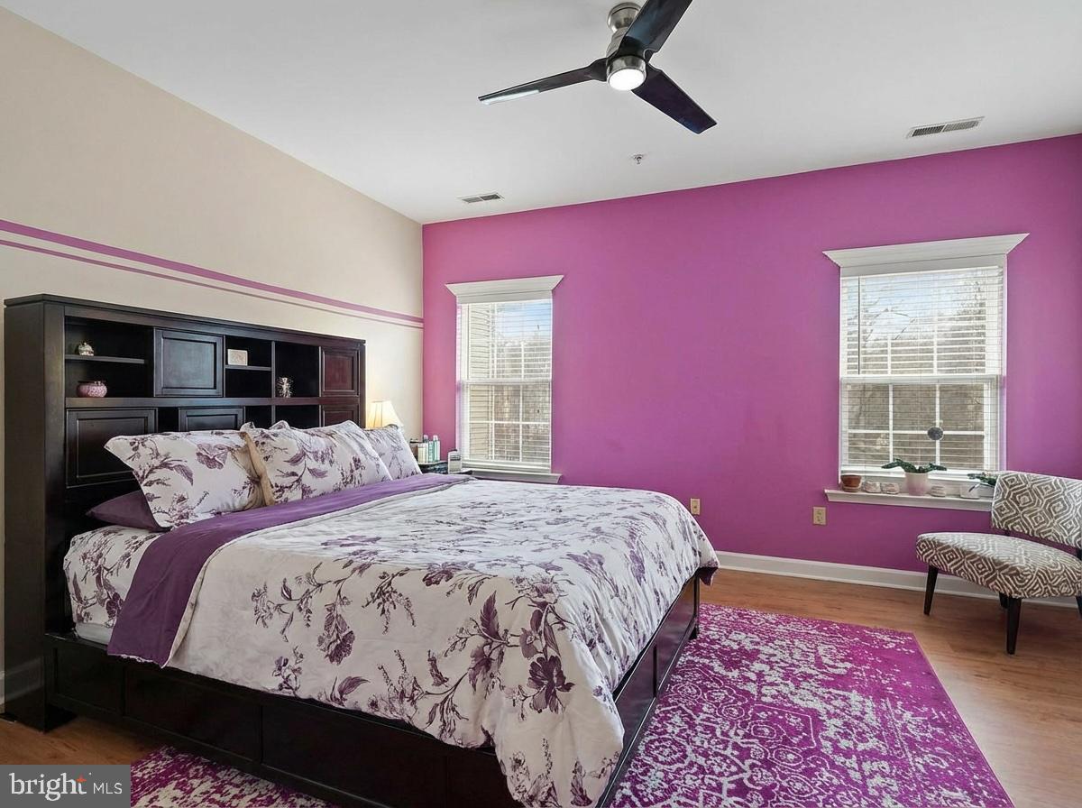 3261 Nile Lane Laurel, MD 20724 - Photo 12 of 21 a bedroom with a large bed and a couch