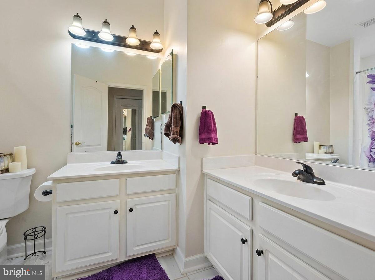 3261 Nile Lane Laurel, MD 20724 - Photo 14 of 21 a bathroom with a sink and a mirror