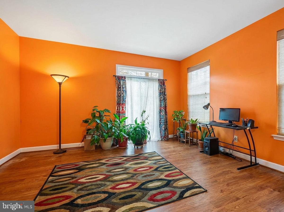 3261 Nile Lane Laurel, MD 20724 - Photo 18 of 21 a bedroom with a bed a table and potted plants