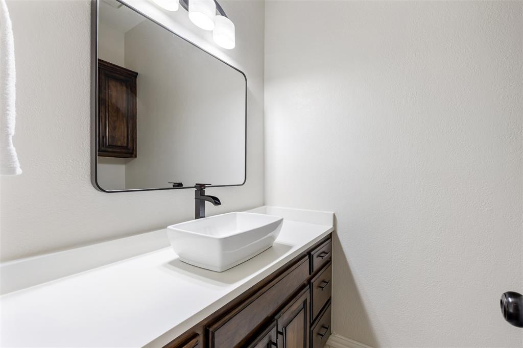 609 Seville Road Denton, TX 76205 - Photo 20 of 40 Half Bath, near front entry, living & bedroom.