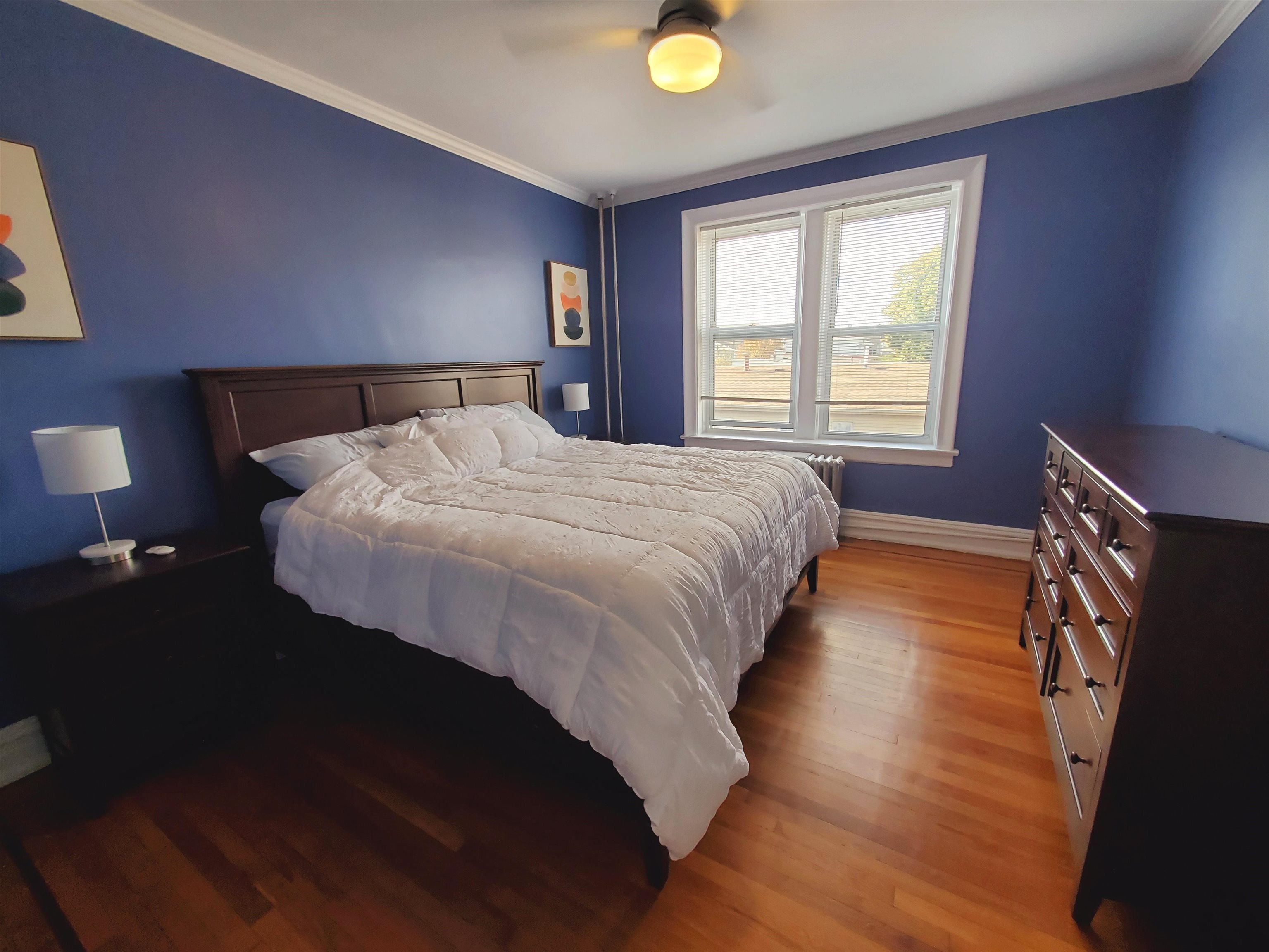 6701 Boulevard East, Unit E4 West New York, NJ 07093 - Photo 4 of 12 a bedroom with a bed and window