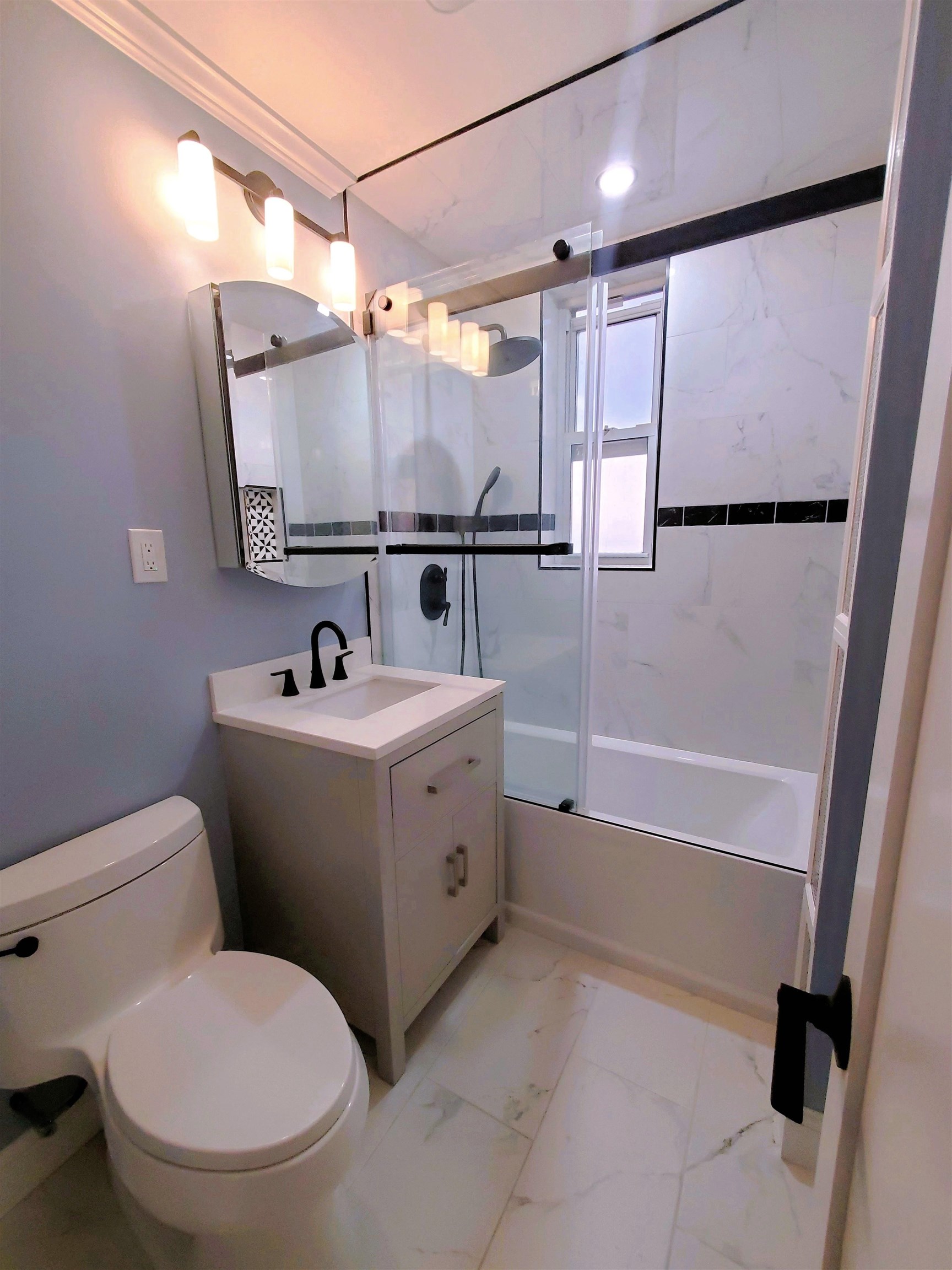6701 Boulevard East, Unit E4 West New York, NJ 07093 - Photo 8 of 12 a bathroom with a sink toilet and shower