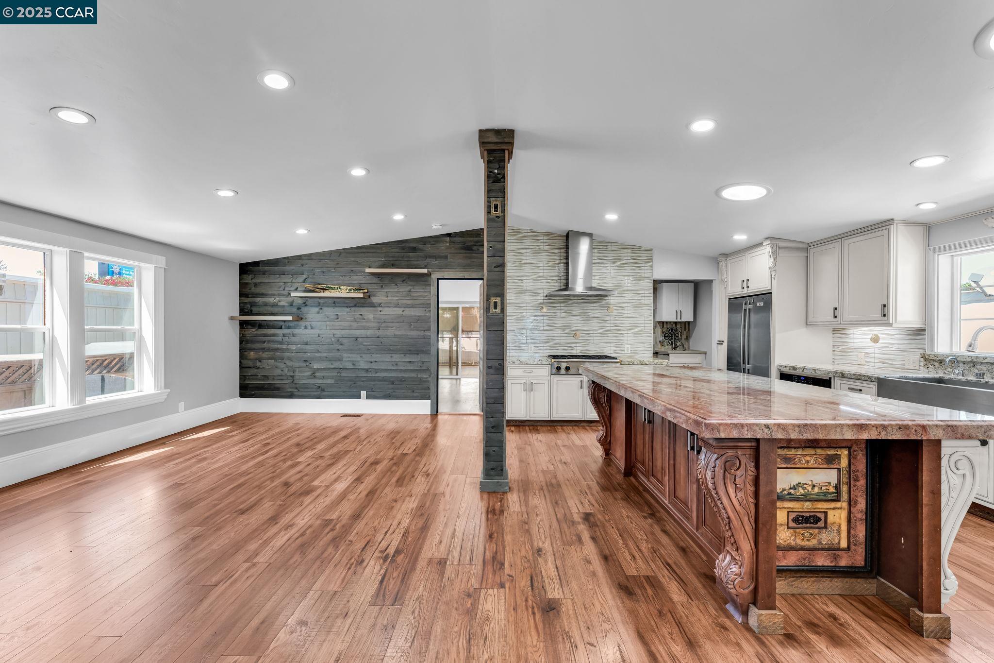 189 Suez Drive, Unit 72 Pacheco, CA 94553 - Photo 11 of 45 a open kitchen with kitchen island a stove a sink a refrigerator and cabinets