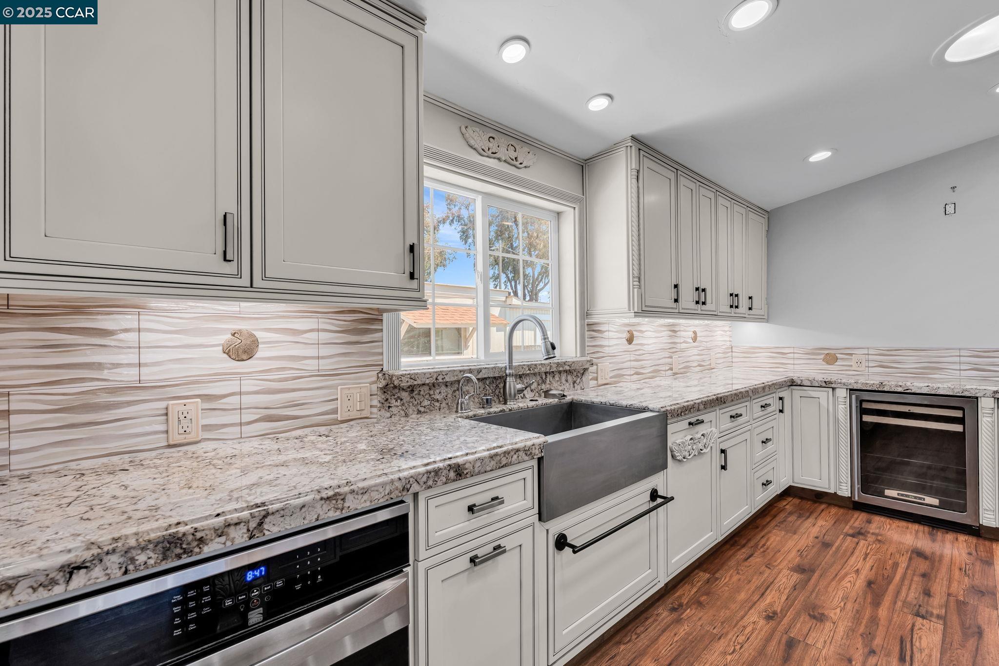 189 Suez Drive, Unit 72 Pacheco, CA 94553 - Photo 12 of 45 a kitchen with granite countertop a sink stainless steel appliances and cabinets
