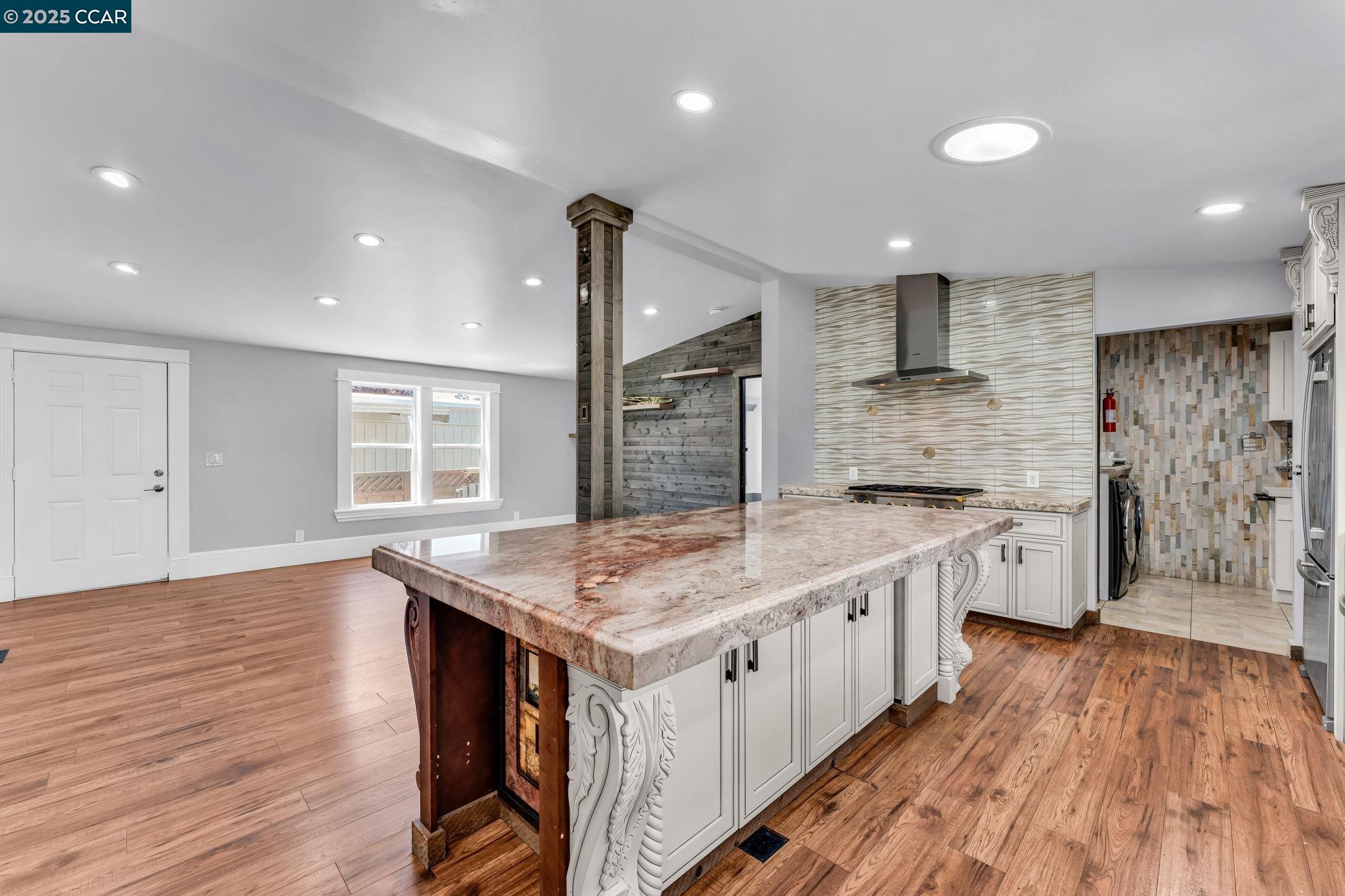 189 Suez Drive, Unit 72 Pacheco, CA 94553 - Photo 13 of 45 a kitchen with stainless steel appliances granite countertop a sink stove and wooden floor