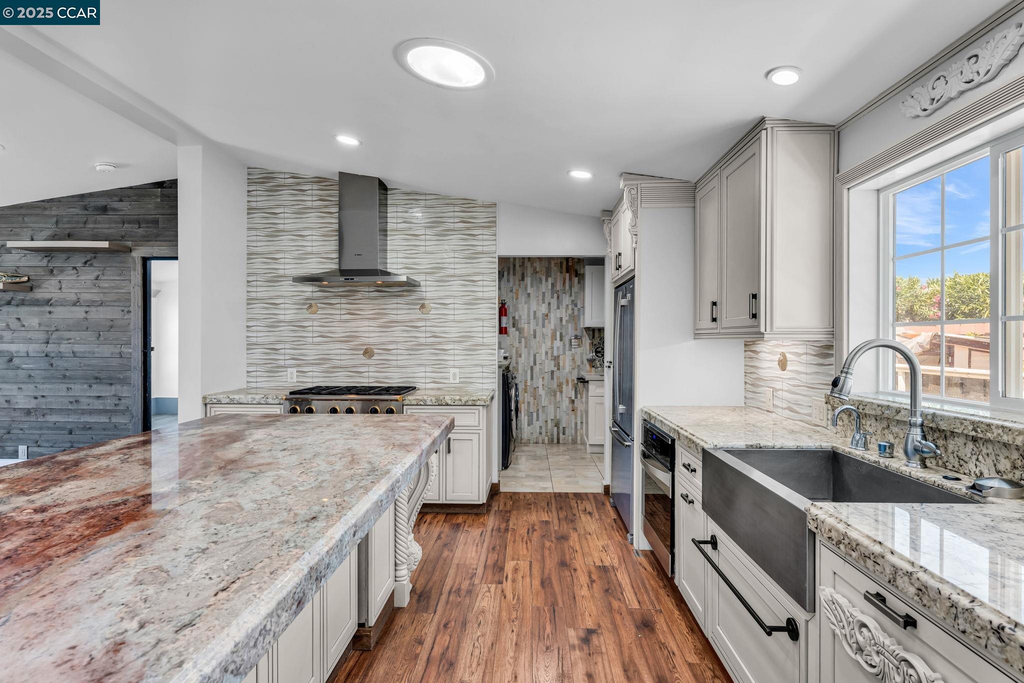 189 Suez Drive, Unit 72 Pacheco, CA 94553 - Photo 14 of 45 a kitchen with stainless steel appliances granite countertop a sink stove and refrigerator