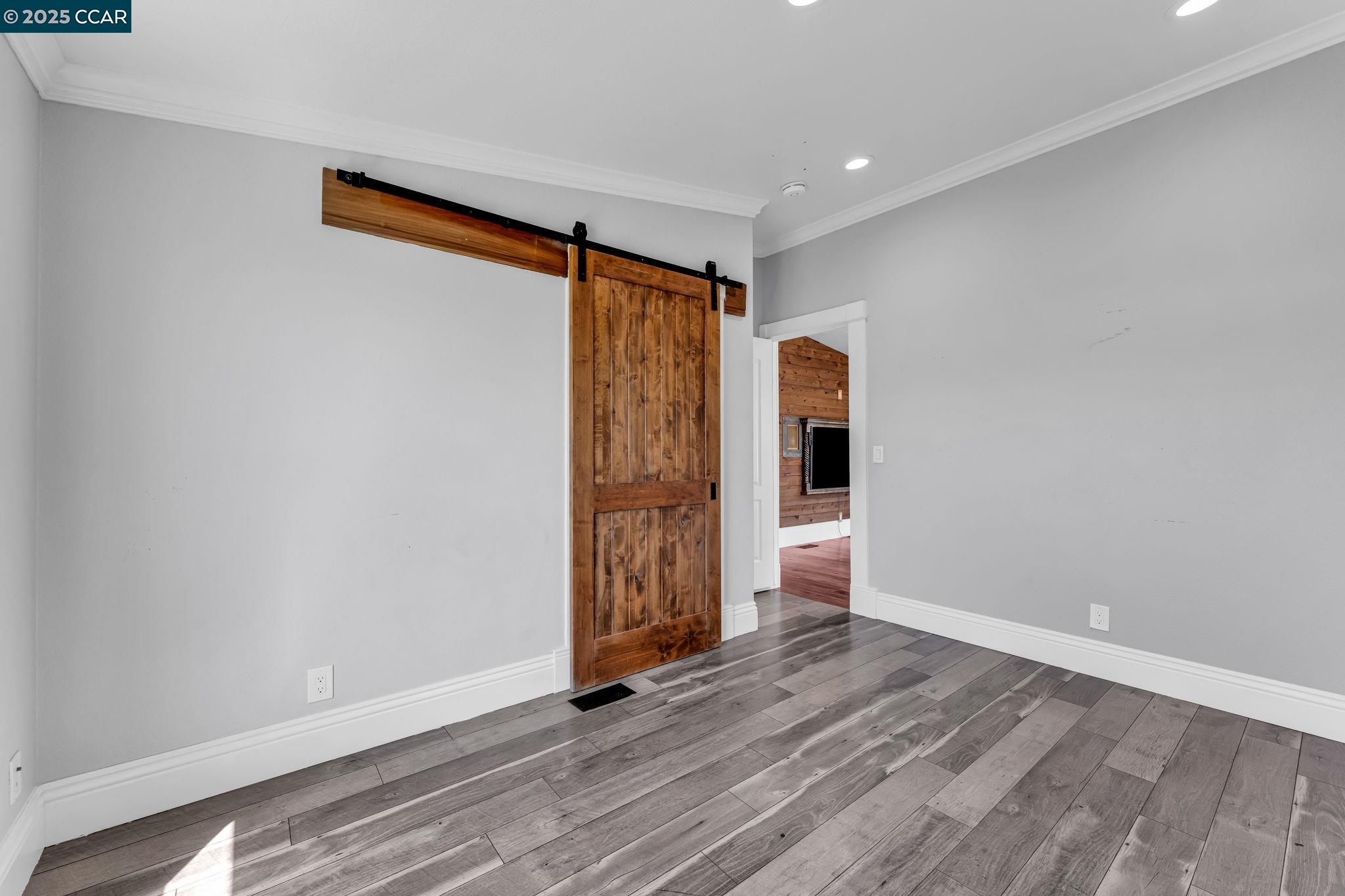 189 Suez Drive, Unit 72 Pacheco, CA 94553 - Photo 18 of 45 a view of an empty room with wooden floor and closet