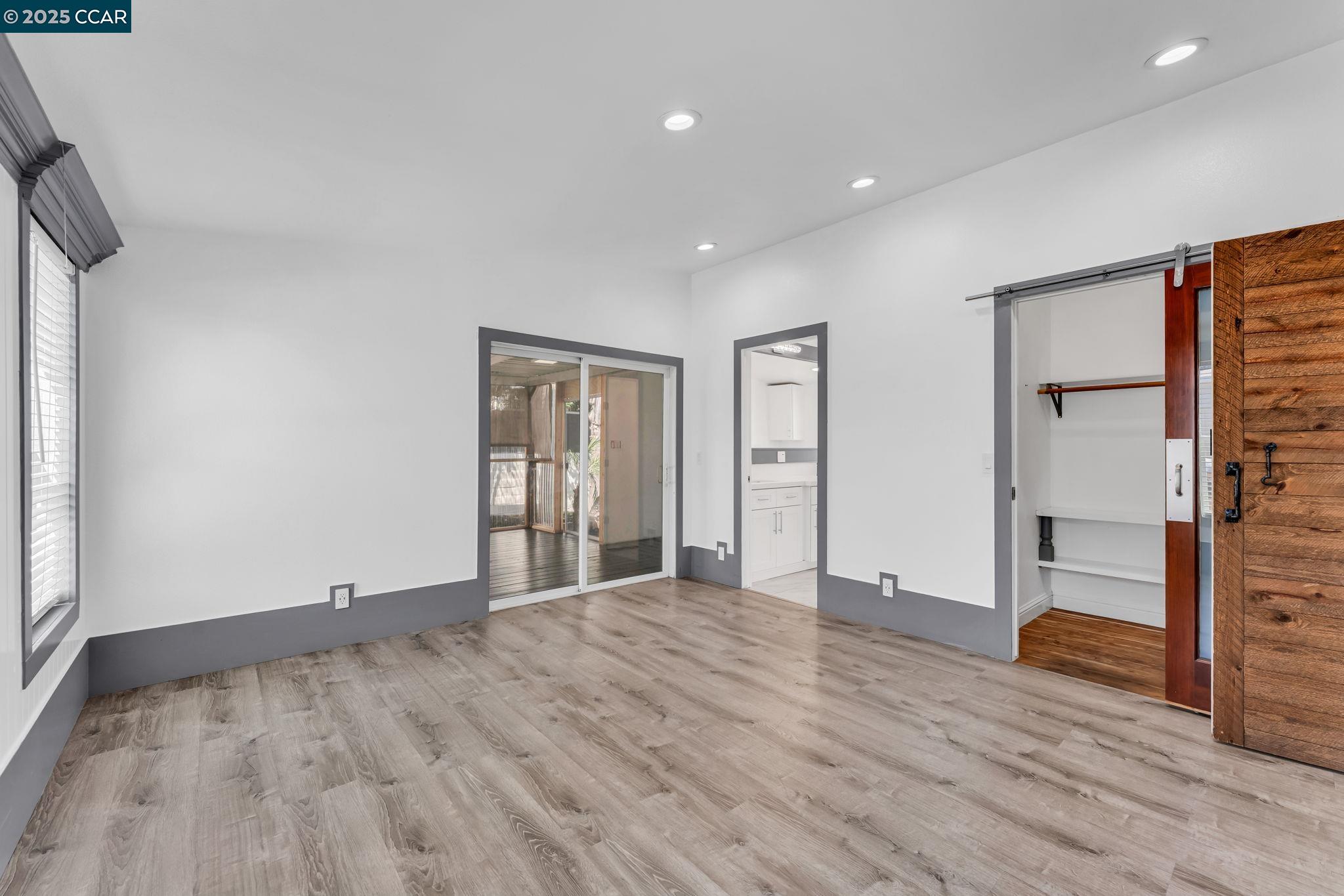 189 Suez Drive, Unit 72 Pacheco, CA 94553 - Photo 25 of 45 a view of empty room with wooden floor