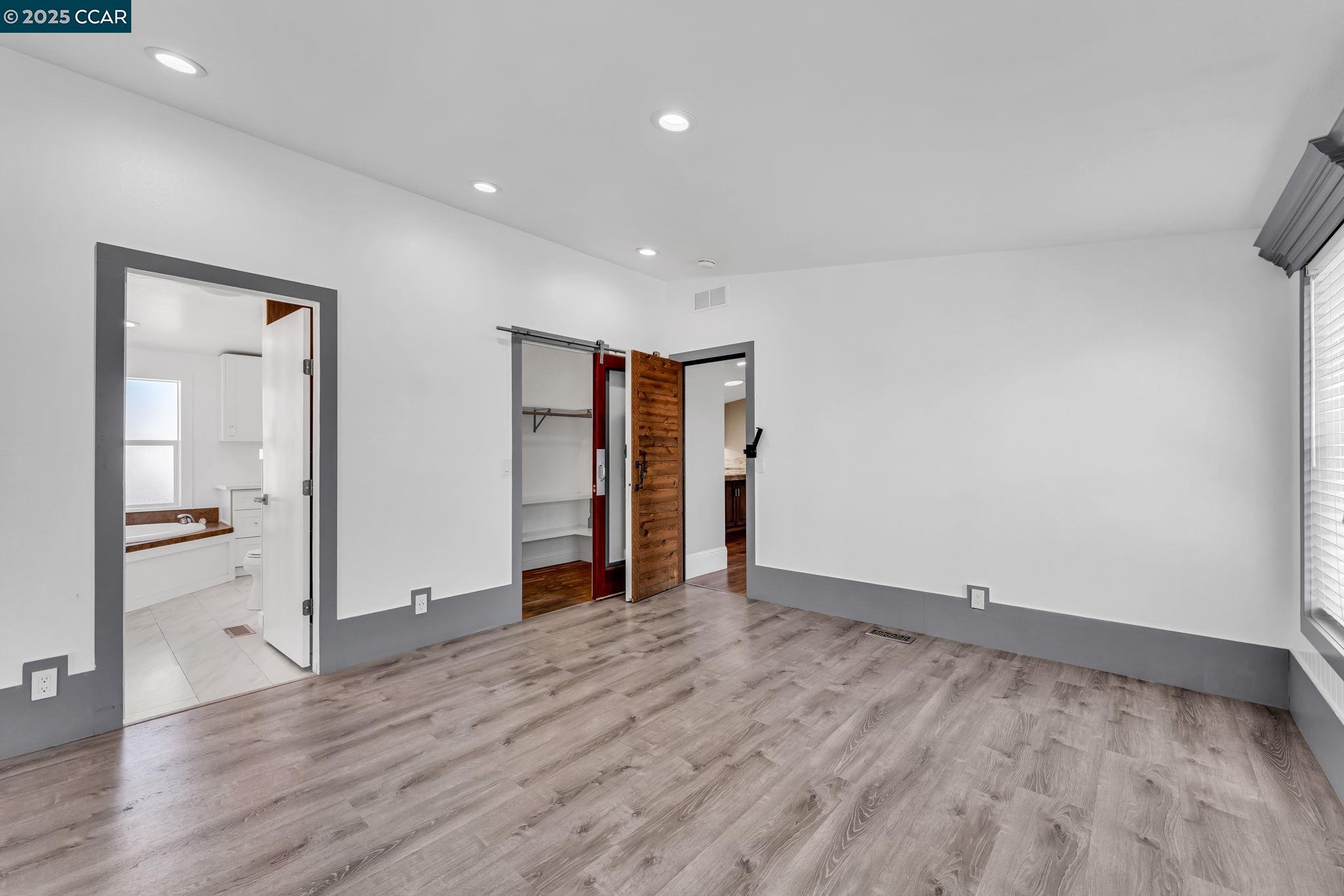 189 Suez Drive, Unit 72 Pacheco, CA 94553 - Photo 27 of 45 a view of an empty room with wooden floor and closet
