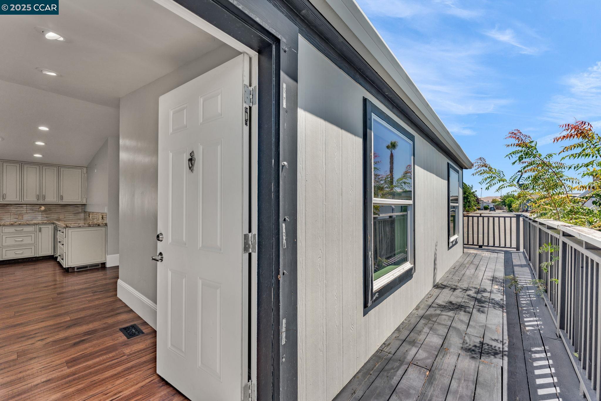 189 Suez Drive, Unit 72 Pacheco, CA 94553 - Photo 3 of 45 a view of a house with deck and wooden floor
