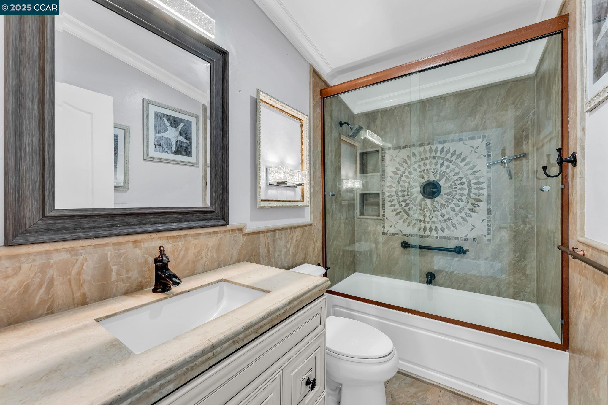 189 Suez Drive, Unit 72 Pacheco, CA 94553 - Photo 31 of 45 a bathroom with a granite countertop sink a toilet and shower