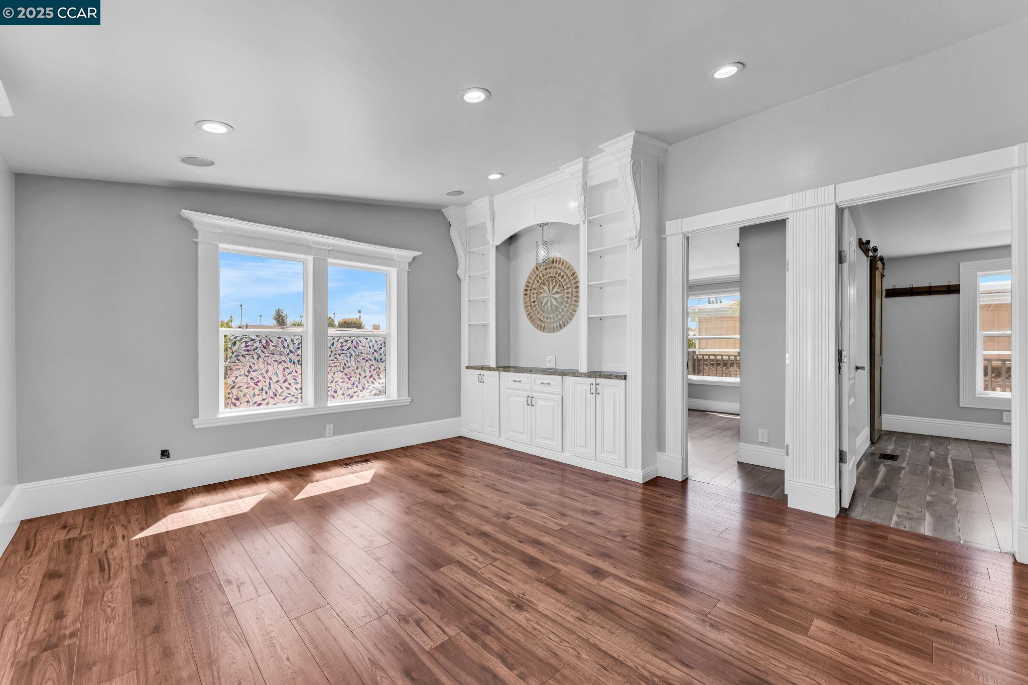 189 Suez Drive, Unit 72 Pacheco, CA 94553 - Photo 36 of 45 a view of an empty room with wooden floor and a window