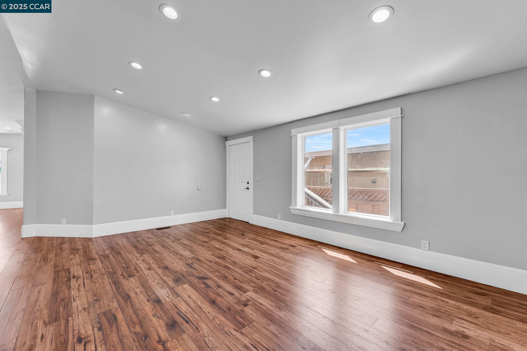 189 Suez Drive, Unit 72 Pacheco, CA 94553 - Photo 41 of 45 a view of empty room with wooden floor and fan