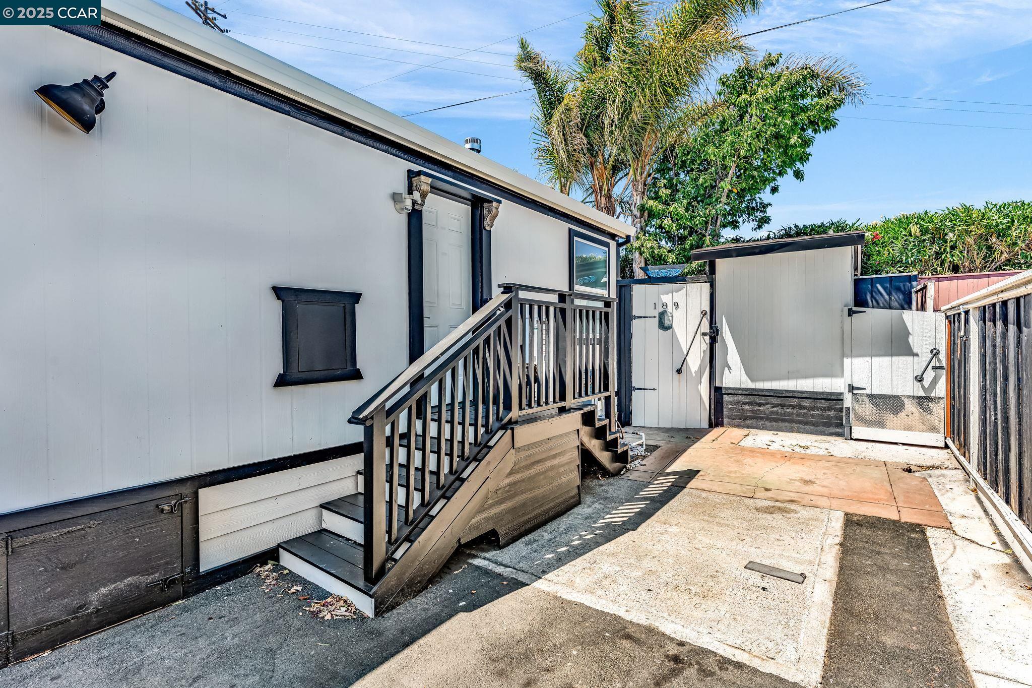 189 Suez Drive, Unit 72 Pacheco, CA 94553 - Photo 45 of 45 a view of a porch with two couches and wooden fence