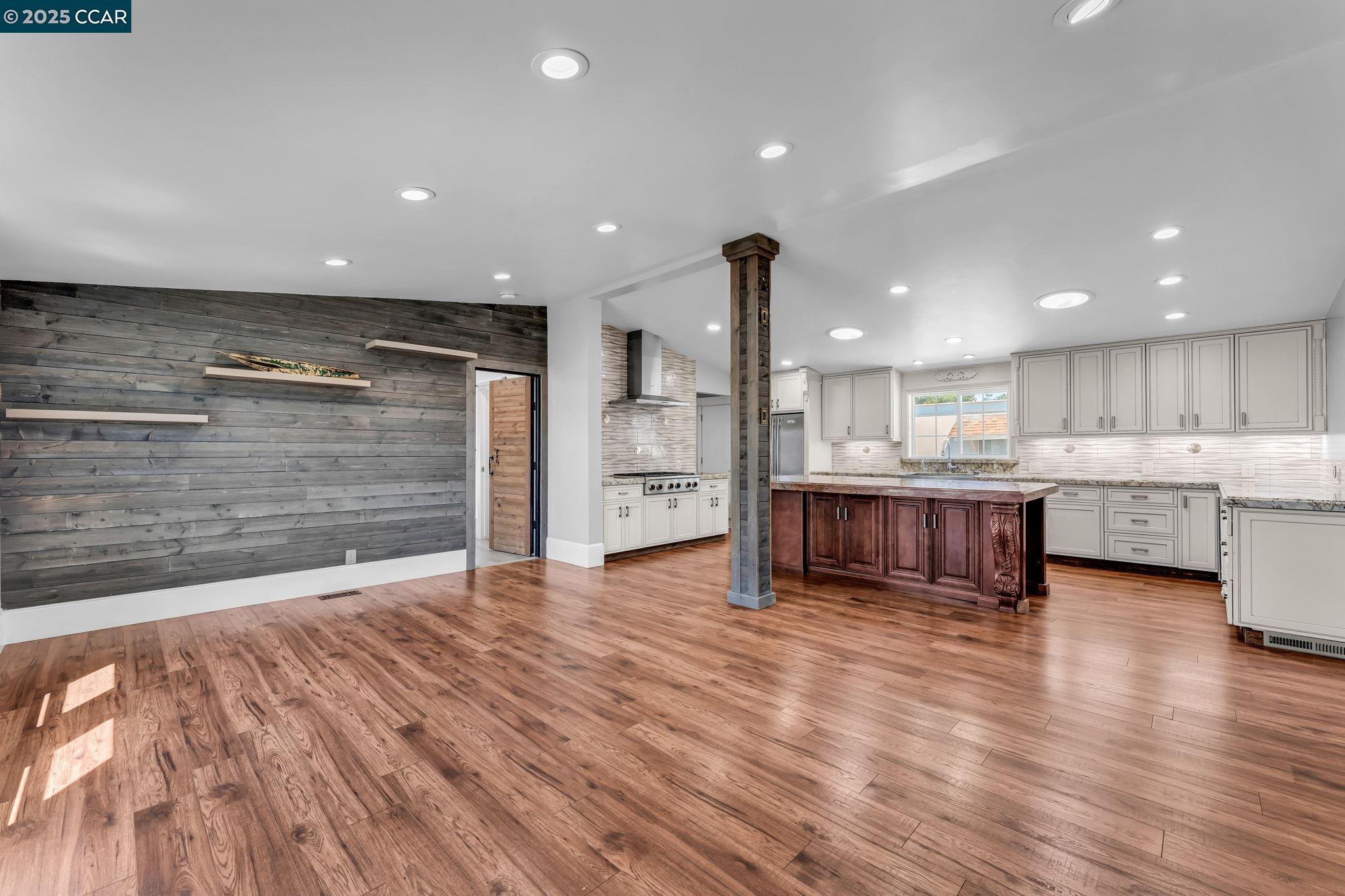 189 Suez Drive, Unit 72 Pacheco, CA 94553 - Photo 5 of 45 a view of kitchen with kitchen island a sink wooden floor and a counter top space