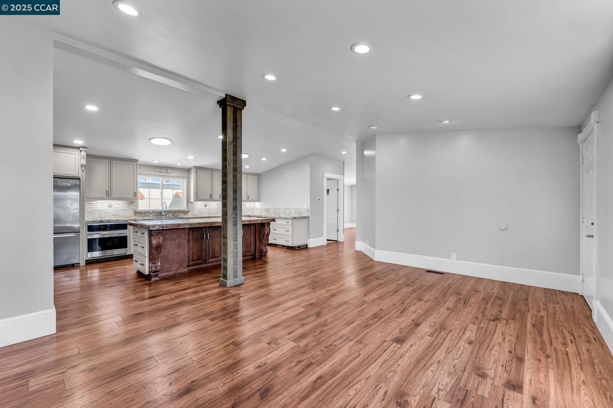 189 Suez Drive, Unit 72 Pacheco, CA 94553 - Photo 6 of 45 a view of kitchen with kitchen island sink and refrigerator