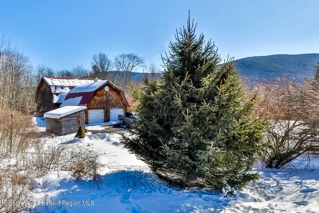 a view of a porch with wooden floor
