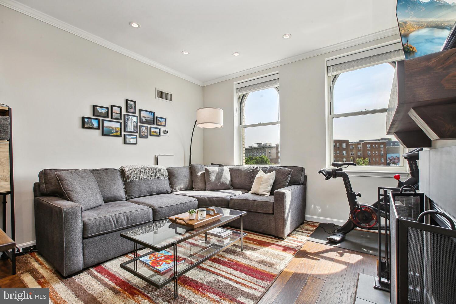 2000 16th Street Northwest, Unit 605 Washington, DC 20009 - Photo 5 of 16 a living room with furniture and a window