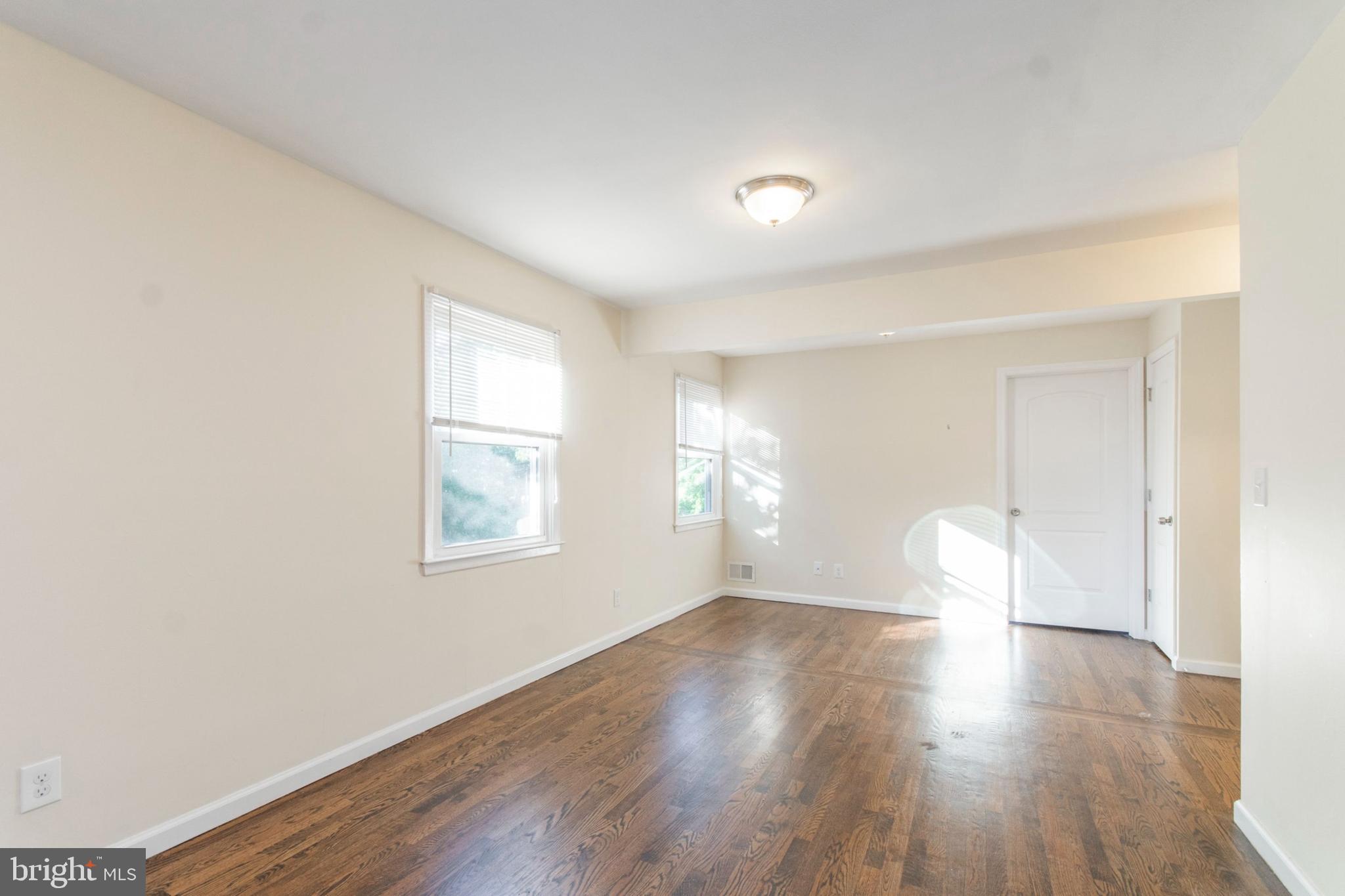 151 North Harrison Street Princeton, NJ 08540 - Photo 16 of 19 an empty room with wooden floor and windows