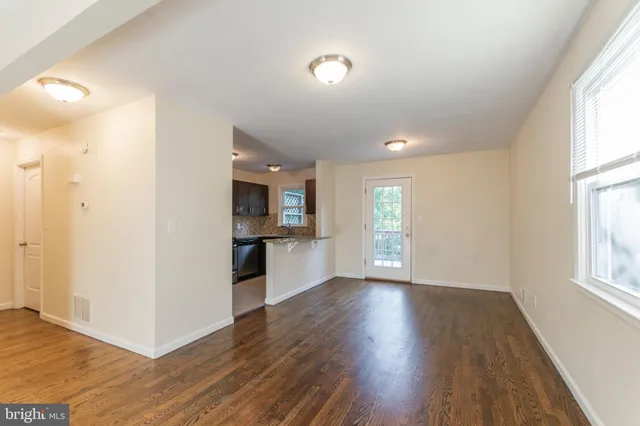 a view of kitchen and wooden floor