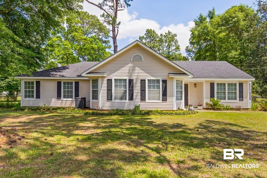 1301 Repoll Road Mobile, AL 36695 - Photo 1 of 21 Single-story residence featuring light-colored siding and a dark shingle roof