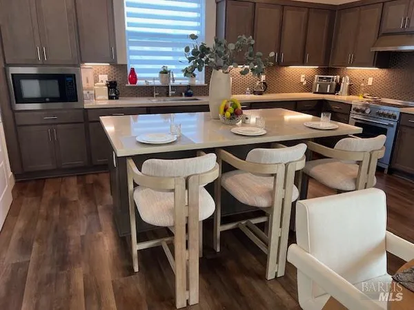 a kitchen with a table chairs and a stove