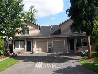 10624 Northeast 175th Street Bothell, WA 98011 - Photo 1 of 17 a front view of a house with a yard and garage